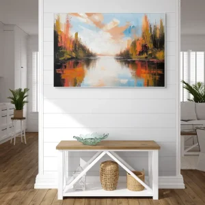 Impressionistic image of a lake surrounded by a forest in warm autumn colours