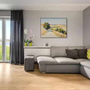 A landscape image with a path between summer fields and trees