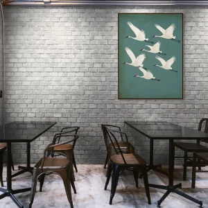 Bytová dekorace s motivem letících bílých jeřábů na zelenomodrém pozadí