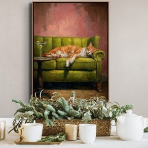 malované obrazy koček – kočka odpočívá na zelené pohovce