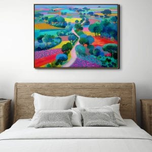 Obraz krajiny malovaný zachycující barevná pole a klikatou cestu